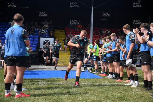 240825 - Ospreys U18s v Cardiff Rugby U18s - Ospreys players run out at the start of the match 