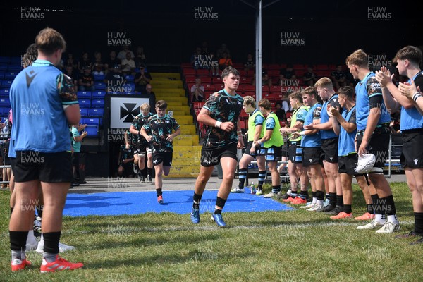 240825 - Ospreys U18s v Cardiff Rugby U18s - Ospreys players run out at the start of the match 