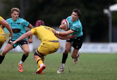 300826 - Ospreys U18s v Dragons U18s - RAG - Harrison Hook of Ospreys is tackled by Gethin Tudball of Dragons 