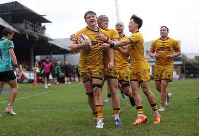 300826 - Ospreys U18s v Dragons U18s - RAG - Troy Raymond of Dragons celebrates scoring a try