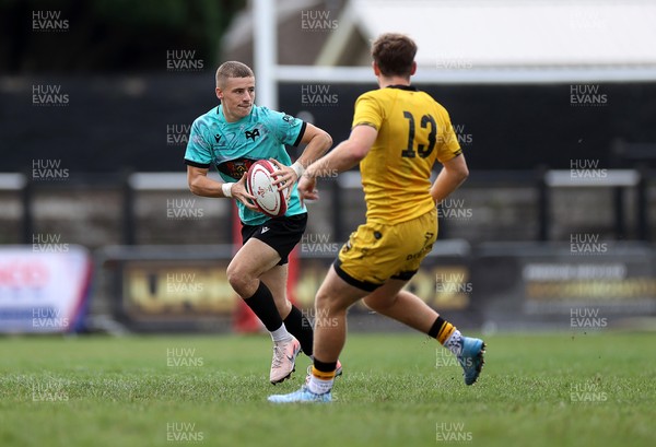 300826 - Ospreys U18s v Dragons U18s - RAG - Dylan Quin of Ospreys is tackled by George Bradbury of Dragons 