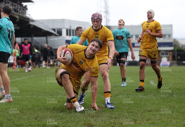300826 - Ospreys U18s v Dragons U18s - RAG - Troy Raymond of Dragons celebrates scoring a try