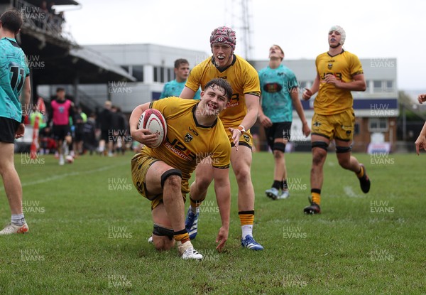 300826 - Ospreys U18s v Dragons U18s - RAG - Troy Raymond of Dragons celebrates scoring a try