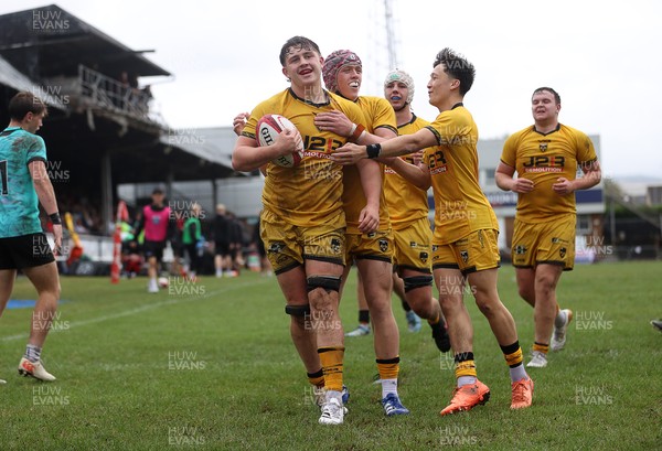 300826 - Ospreys U18s v Dragons U18s - RAG - Troy Raymond of Dragons celebrates scoring a try