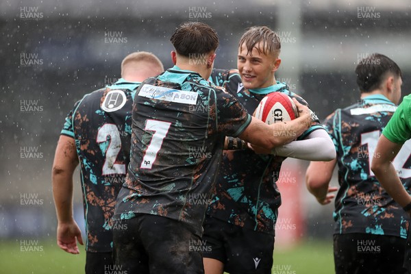 140925 - Ospreys v RGC U18s - Josh Gallivan of Ospreys celebrates scoring a try with team mates