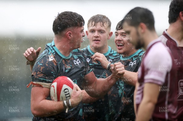 140925 - Ospreys v RGC U18s - Sam Morgan of Ospreys celebrates scoring a try