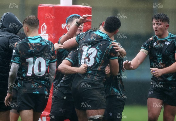 140925 - Ospreys v RGC U18s - Ethan Bolche of Ospreys celebrates scoring a try with team mates
