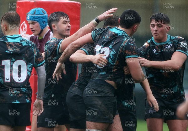 140925 - Ospreys v RGC U18s - Ethan Bolche of Ospreys celebrates scoring a try with team mates