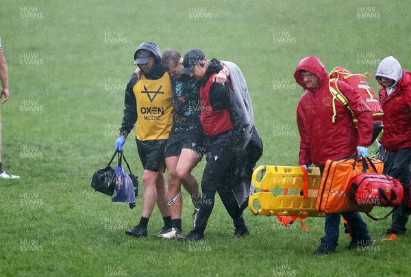140925 - Ospreys v RGC U18s - Will Jones of Ospreys leaves the field injured