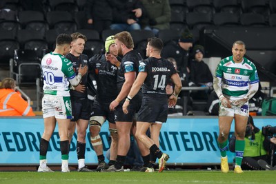 040323 - Ospreys v Benetton - United Rugby Championship - Jacob Umaga of Benetton and Ospreys players console Jack Walsh of Ospreys after his conversion hits the posts