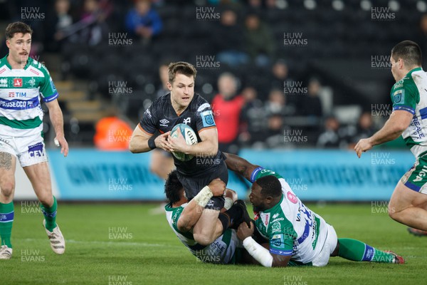 040323 - Ospreys v Benetton - United Rugby Championship - Michael Collins of Ospreys is tackled by Cherif Traore of Benetton