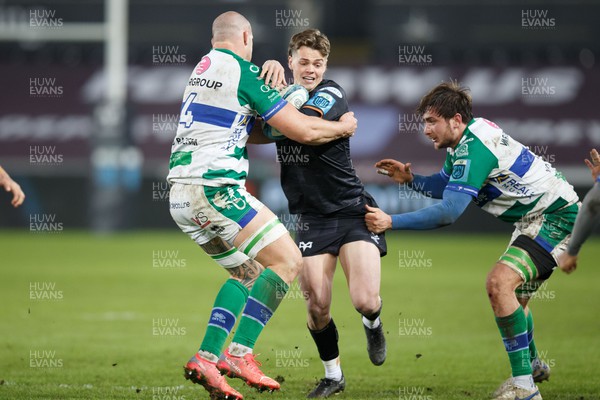 040323 - Ospreys v Benetton - United Rugby Championship - Jack Walsh of Ospreys is tackled by Marco Lazzaroni of Benetton