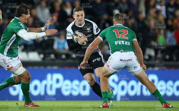 220918 - Ospreys v Benetton Rugby - Guinness PRO14 - George North of Ospreys is tackled by Alberto Sgarbi of Benetton