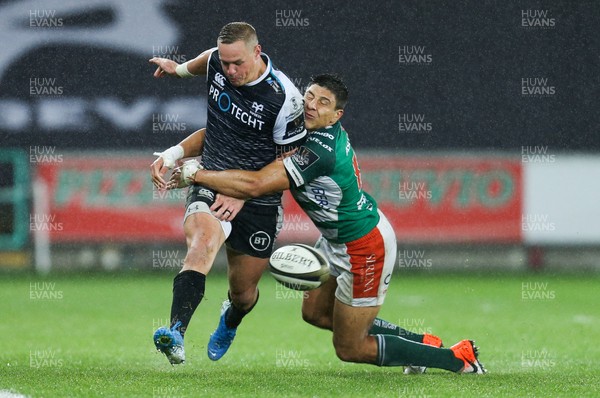 121019 - Ospreys v Benetton Rugby Treviso, Guinness PRO14 - Hanno Dirksen of Ospreys is tackled by Ignacio Brex of Benetton Rugby
