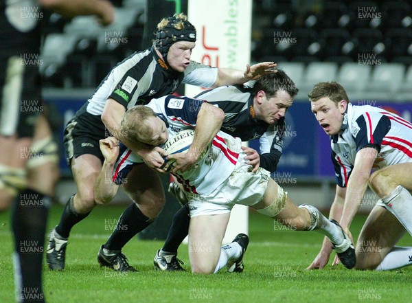 170206 Ospreys v Borders Borders Calcum MacRae is held by Shaun Connor and Richard Pugh 