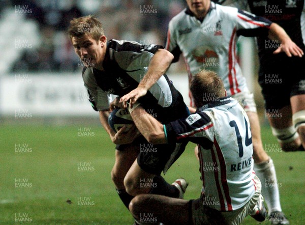 031205 - Celtic League Rugby Ospreys v Borders Ospreys' Richard Mustoe is tackled by Stuart Moffat 