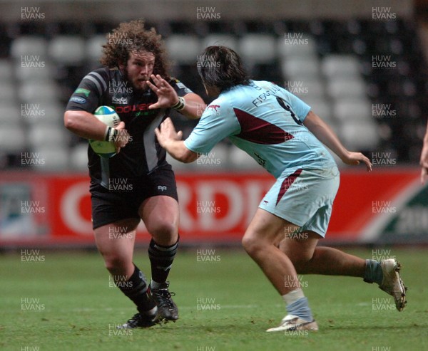 10.11.07 - Ospreys v Bourgoin - Heineken Cup - Ospreys' Adam Jones takes on Bourgoin's Wessel Jooste 