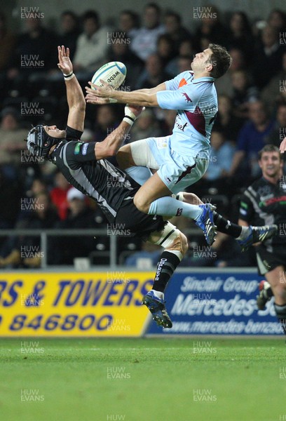 10.11.07..Ospreys v Bourgoin, Heineken Cup Bourgoin's Matthieu Nicolas wins the battle with Ospreys' Marty Holah  for the high ball 