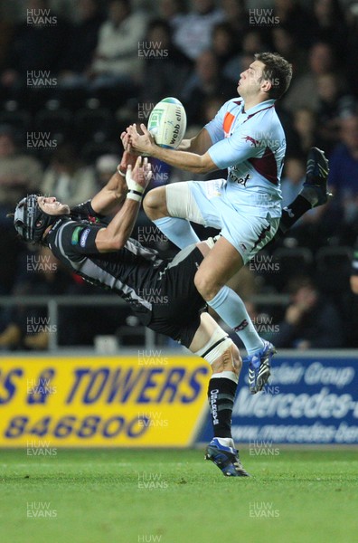 10.11.07..Ospreys v Bourgoin, Heineken Cup Bourgoin's Matthieu Nicolas wins the battle with Ospreys' Marty Holah  for the high ball 