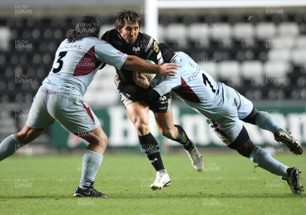 10.11.07..Ospreys v Bourgoin, Heineken Cup Ospreys' Gavin Henson is tackled by Bourgoin's Olivier Sourgens and Arnaud Tchougong 