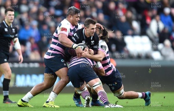 060118 - Ospreys v Cardiff Blues - Guinness PRO14 - Ashley Beck of Ospreys  is tackled by Nick Williams, Olly Robinson and Josh Navidi of Cardiff Blues
