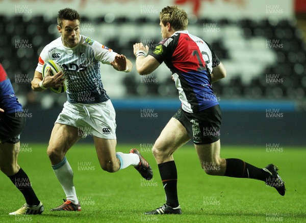 151113 - Ospreys v Cardiff Blues - LV= Cup - Chris Czekaj of Cardiff Blues is tackled by Jonathan Spratt of Ospreys