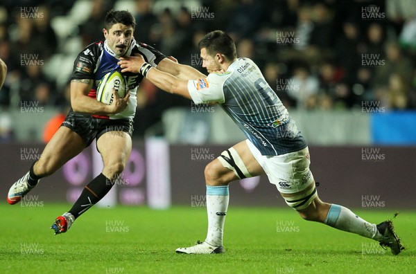 151113 - Ospreys v Cardiff Blues - LV= Cup - Tito Tebaldi of Ospreys is tackled by Ellis Jenkins of Cardiff Blues