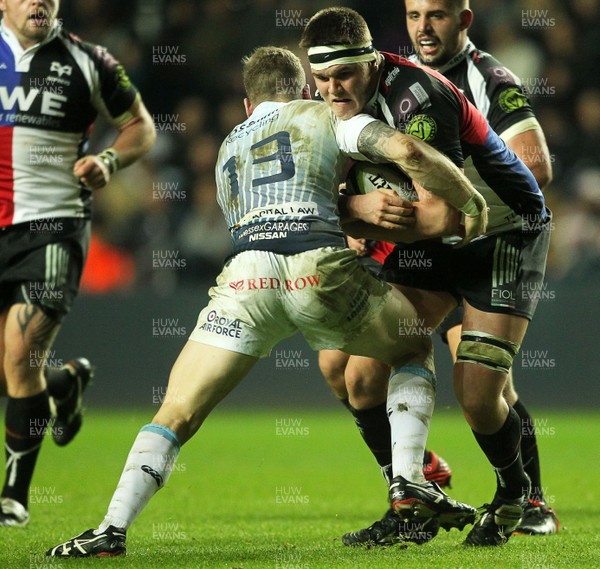 151113 - Ospreys v Cardiff Blues - LV= Cup - Lloyd Peers of Ospreys is tackled by Gavin Evans of Cardiff Blues