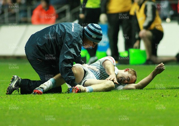 151113 Ospreys v Cardiff Blues - LV=Cup -Blues' Dan Fish struggles with an injury before leaving the field