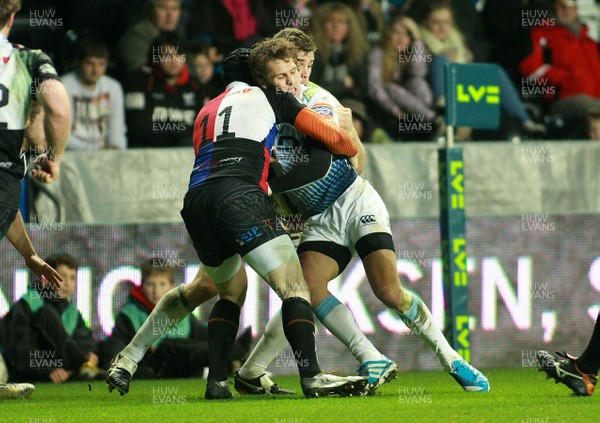 151113 Ospreys v Cardiff Blues - LV=Cup -Blues' Tom Williams is tackled by Ospreys' Dafydd Howells