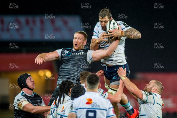 211219 - Ospreys v Cardiff Blues - Guinness PRO14 - Bradley Davies of Ospreys and Josh Turnbull of Cardiff Blues jump for the ball 