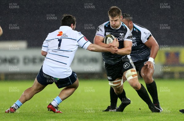 211219 - Ospreys v Cardiff Blues - Guinness PRO14 - Olly Cracknell of Ospreys is tackled by Brad Thyer of Cardiff Blues