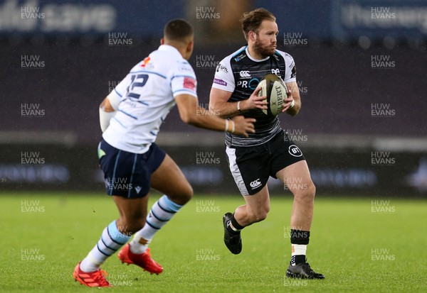 211219 - Ospreys v Cardiff Blues - Guinness PRO14 - Marty McKenzie of Ospreys is challenged by Ben Thomas of Cardiff Blues