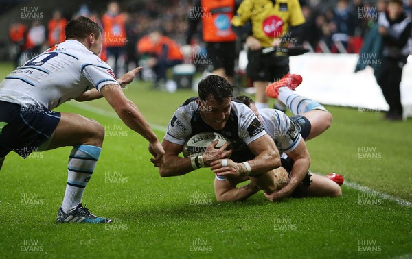 211219 - Ospreys v Cardiff Blues - Guinness PRO14 - Luke Morgan of Ospreys is pushed into touch just short of the try line by Jarrod Evans and Owen Lane of Cardiff Blues