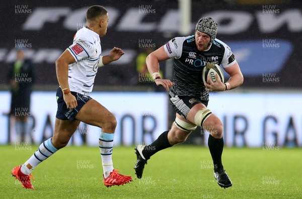 211219 - Ospreys v Cardiff Blues - Guinness PRO14 - Dan Lydiate of Ospreys is tackled by Ben Thomas of Cardiff Blues