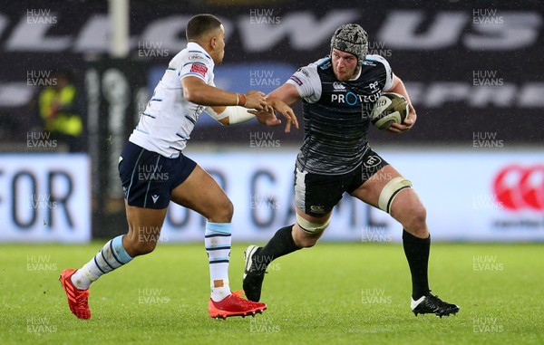 211219 - Ospreys v Cardiff Blues - Guinness PRO14 - Dan Lydiate of Ospreys is tackled by Ben Thomas of Cardiff Blues