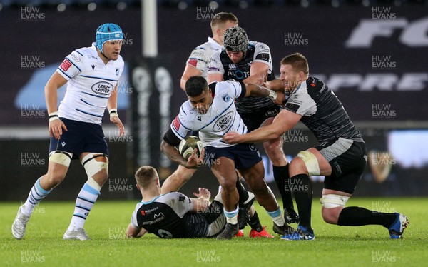 211219 - Ospreys v Cardiff Blues - Guinness PRO14 - Rey Lee-Lo of Cardiff Blues is tackled by Dan Lydiate and Bradley Davies of Ospreys