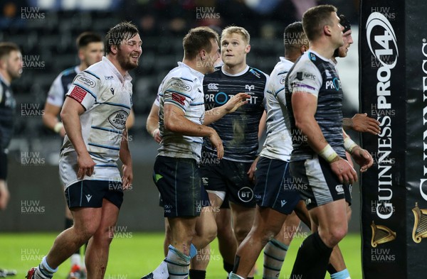 211219 - Ospreys v Cardiff Blues - Guinness PRO14 - Jarrod Evans of Cardiff Blues celebrates scoring a try with team mates