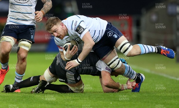 211219 - Ospreys v Cardiff Blues - Guinness PRO14 - Macauley Cook of Cardiff Blues is tackled by Justin Tipuric of Ospreys