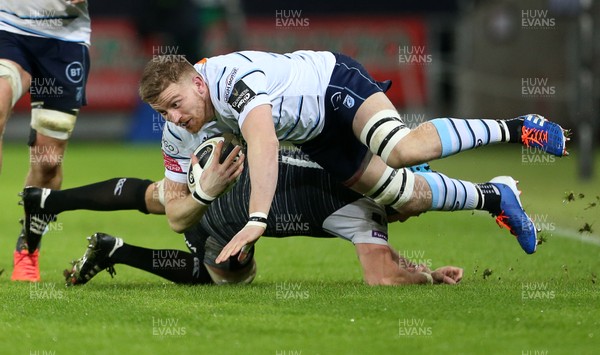 211219 - Ospreys v Cardiff Blues - Guinness PRO14 - Macauley Cook of Cardiff Blues is tackled by Justin Tipuric of Ospreys