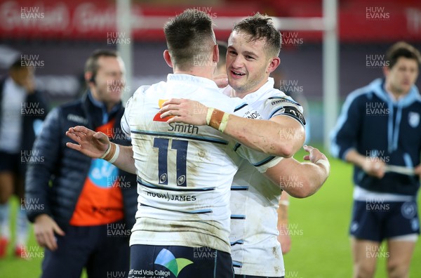 211219 - Ospreys v Cardiff Blues - Guinness PRO14 - Josh Adams and Hallam Amos of Cardiff Blues celebrate at full time