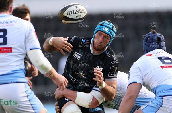 240421 - Ospreys v Cardiff Blues - Rainbow Cup - Justin Tipuric of Ospreys is tackled by Gwilym Bradley of Cardiff Blues