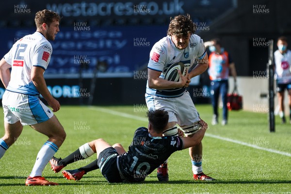240421 - Ospreys v Cardiff Blues - Guinness PRO14 Rainbow Cup - Ben Murphy of Cardiff Blues is tackled by Josh Thomas of Ospreys