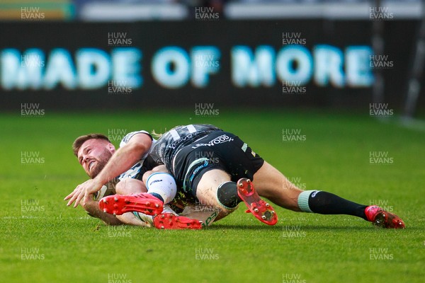 240421 - Ospreys v Cardiff Blues - Guinness PRO14 Rainbow Cup - Owen Lane of Cardiff Blues is tackled by Mat Protheroe of Ospreys