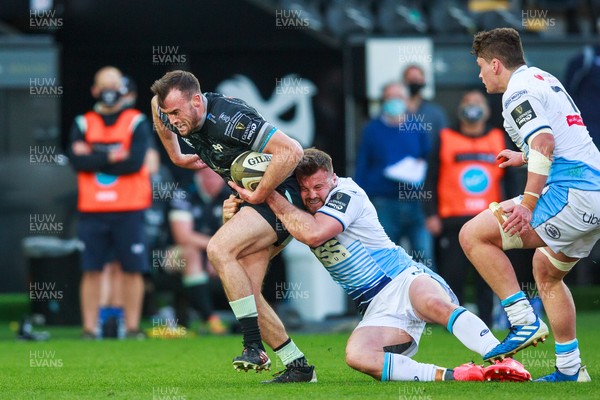 240421 - Ospreys v Cardiff Blues - Guinness PRO14 Rainbow Cup - Cai Evans of Ospreys is tackled