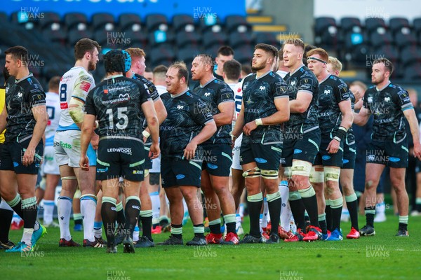 240421 - Ospreys v Cardiff Blues - Guinness PRO14 Rainbow Cup - Ospreys and Cardiff Blues players shake hands at the end of the match