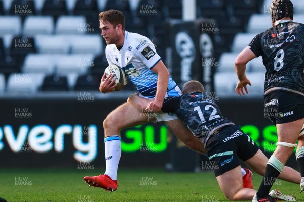 240421 - Ospreys v Cardiff Blues - Guinness PRO14 Rainbow Cup - Max Llewellyn of Cardiff Blues is tackled by Kieran Williams of Ospreys