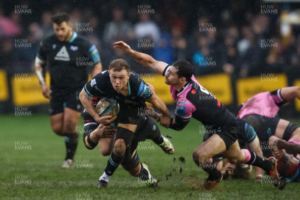 010124 - Ospreys v Cardiff Rugby - United Rugby Championship - Luke Davies of Ospreys is tackled by Tomos Williams of Cardiff