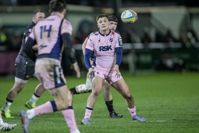 010126 - Ospreys v Cardiff Rugby - United Rugby Championship - Callum Sheedy offloads to Josh Adams of Cardiff Rugby
