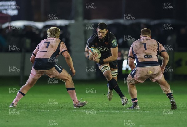 010126 - Ospreys v Cardiff Rugby, United Rugby Championship - Rhys Davies of Ospreys takes on Dan Thomas of Cardiff Rugby and Danny Southworth of Cardiff Rugby